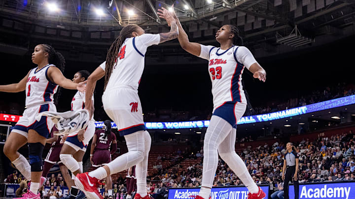 Mar 6, 2025; Greenville, SC, USA; Ole Miss Rebels forward Kharyssa Richardson (33) and guard Madison Scott (24) celebrate after a play against the Mississippi State Bulldogs during the first half at Bon Secours Wellness Arena. Mandatory Credit: Scott Kinser-Imagn Images