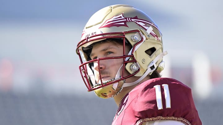 Nov 23, 2024; Tallahassee, Florida, USA; Florida State Seminoles quarterback Brock Glenn (11) warms up before the game against the Charleston Southern Buccaneers at Doak S. Campbell Stadium. Mandatory Credit: Melina Myers-Imagn Images