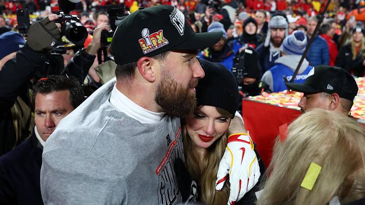 Taylor Swift  and Kansas City Chiefs tight end Travis Kelce (87) react after the AFC Championship game against the Buffalo Bills at GEHA Field at Arrowhead Stadium.