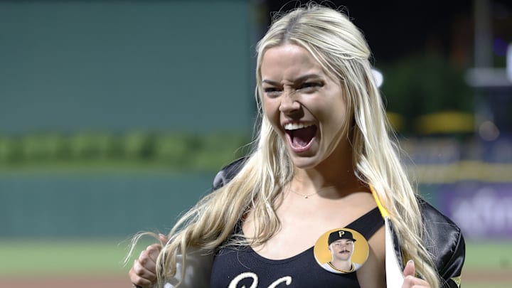 May 11, 2024; Pittsburgh, Pennsylvania, USA; Louisiana State University gymnast Olivia Dunn reacts on the field after her boyfriend Pittsburgh Pirates starting pitcher Paul Skenes (not pictured) made his major league debut against the Chicago Cubs at PNC Park. The Pirates won 10-8. Mandatory Credit: Charles LeClaire-Imagn Images