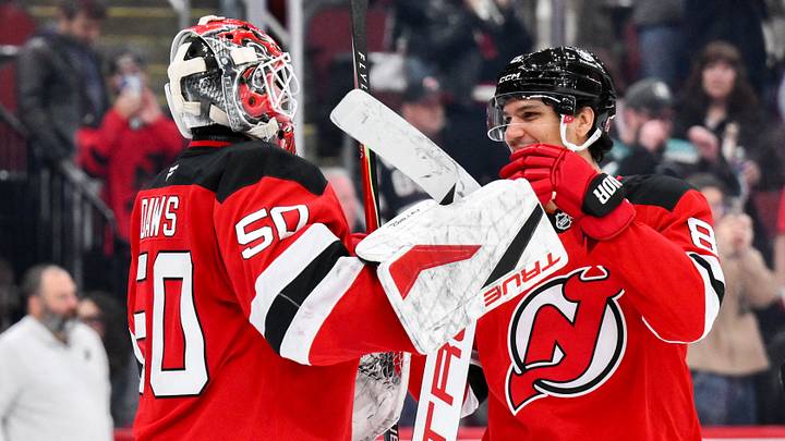 Oct 22, 2026; Newark, New Jersey, USA;  New Jersey Devils goaltender Nico Daws (50) is greeted by defenseman Johnathan Kovacevic (8) after winning against the Anaheim Ducks at Prudential Center.  Mandatory Credit: John Jones-Imagn Images