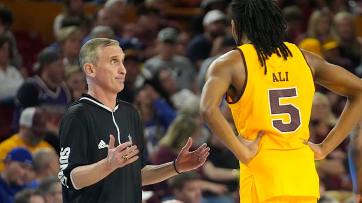 Arizona State head coach Bobby Hurley talks with Arizona State guard Amier Ali (5).