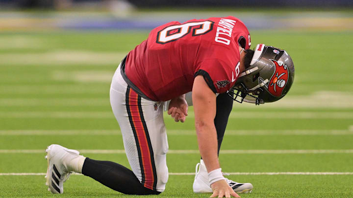 Nov 23, 2025; Inglewood, California, USA; Tampa Bay Buccaneers quarterback Baker Mayfield (6) kneels on the field with an apparent injury against the Los Angeles Rams during the second quarter at SoFi Stadium. Mandatory Credit: Jayne Kamin-Oncea-Imagn Images