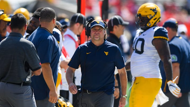 Dana Holgorsen patrols the sideline during his tenure at WVU.