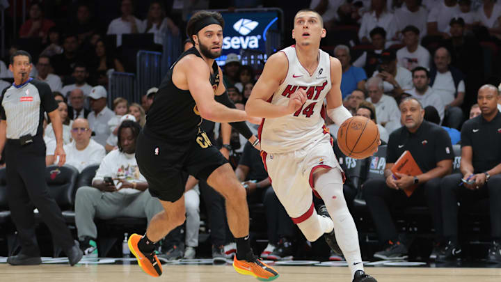 Apr 26, 2025; Miami, Florida, USA; Miami Heat guard Tyler Herro (14) drives to the basket past Cleveland Cavaliers guard Max Strus (1) in the third quarter during game three for the first round of the 2025 NBA Playoffs at Kaseya Center. Mandatory Credit: Sam Navarro-Imagn Images Apr 26, 2025; Miami, Florida, USA; Miami Heat guard Tyler Herro (14) drives to the basket past Cleveland Cavaliers guard Max Strus (1) in the third quarter during game three for the first round of the 2025 NBA Playoffs at Kaseya Center. Mandatory Credit: Sam Navarro-Imagn Images