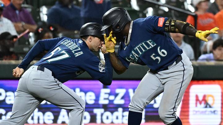 Jun 9, 2026; Baltimore, Maryland, USA; Seattle Mariners left fielder Randy Arozarena (56) celebrates hitting a two run home run with Seattle Mariners third base coach Carlos Cardoza (57) during the tenth inning against the Baltimore Orioles at Oriole Park at Camden Yards. Mandatory Credit: James A. Pittman-Imagn Images Jun 9, 2026; Baltimore, Maryland, USA; Seattle Mariners left fielder Randy Arozarena (56) celebrates hitting a two run home run with Seattle Mariners third base coach Carlos Cardoza (57) during the tenth inning against the Baltimore Orioles at Oriole Park at Camden Yards. Mandatory Credit: James A. Pittman-Imagn Images