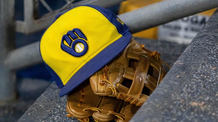 Apr 21, 2026; Detroit, Michigan, USA; A Milwaukee Brewers hat and glove in the dugout during the seventh inning against the Detroit Tigers at Comerica Park. Mandatory Credit: David Reginek-Imagn Images