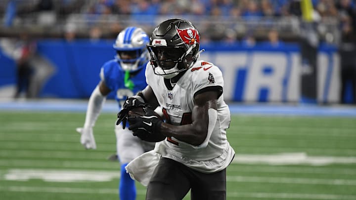 Sep 15, 2024; Detroit, Michigan, USA; Tampa Bay Buccaneers wide receiver Chris Godwin (14) scores a touchdown against the Detroit Lions in the second quarter at Ford Field. Mandatory Credit: Eamon Horwedel-Imagn Images