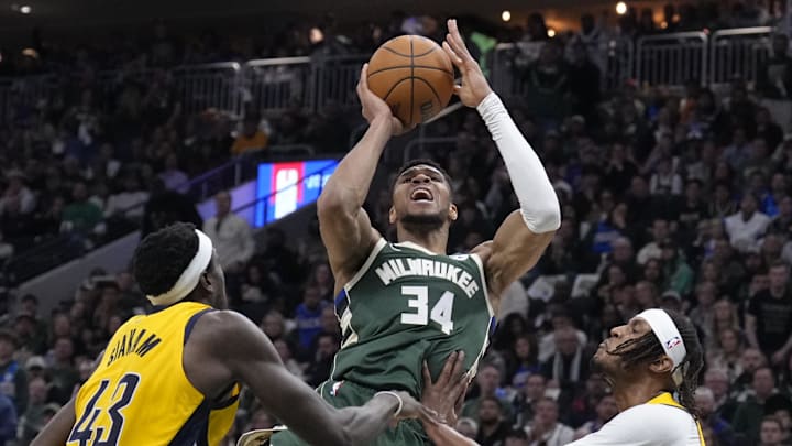 Apr 25, 2025; Milwaukee, Wisconsin, USA; Milwaukee Bucks forward Giannis Antetokounmpo (34) puts up a shot against Indiana Pacers forward Pascal Siakam (43) and Indiana Pacers center Myles Turner (33) in the second half during game three of first round for the 2024 NBA Playoffs at Fiserv Forum. Mandatory Credit: Michael McLoone-Imagn Images