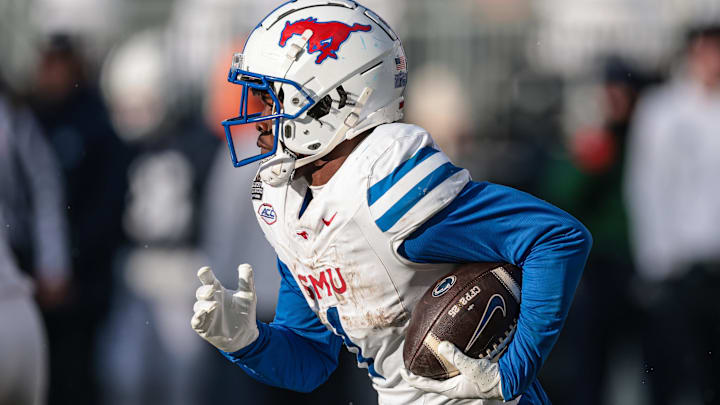 Dec 21, 2024; University Park, Pennsylvania, USA; Southern Methodist Mustangs running back Brashard Smith (1) carries the ball during the second half against the Penn State Nittany Lions at Beaver Stadium. Dec 21, 2024; University Park, Pennsylvania, USA; Southern Methodist Mustangs running back Brashard Smith (1) carries the ball during the second half against the Penn State Nittany Lions at Beaver Stadium.