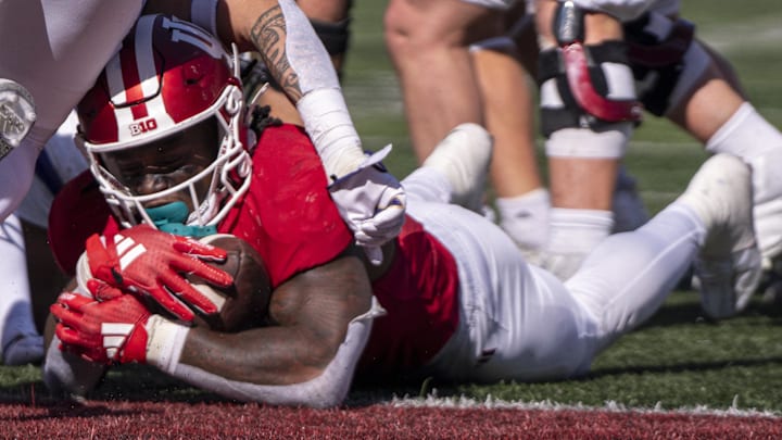 Indiana Hoosiers running back Justice Ellison (6) runs the ball for a touchdown during the third quarter against the Washington Huskies at Memorial Stadium.