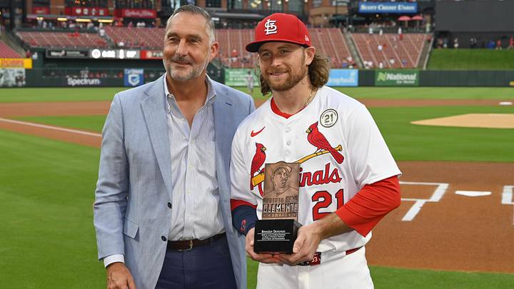 Sep 15, 2025; St. Louis, Missouri, USA; St. Louis Cardinals second baseman Brendan Donovan (21) and President of Baseball Operations John Mozeliak pose for a photo after Donovan is named the St. Louis Cardinals 2025 Roberto Clemente nominee prior to their game against the Cincinnati Reds at Busch Stadium. Mandatory Credit: Joe Puetz-Imagn Images