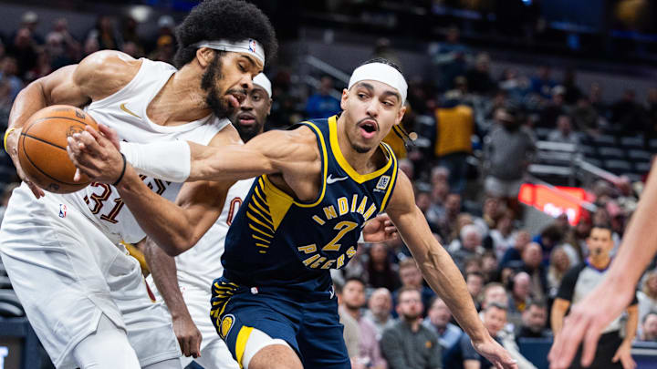 Jan 14, 2025; Indianapolis, Indiana, USA; Cleveland Cavaliers center Jarrett Allen (31) grabs the ball while Indiana Pacers guard Andrew Nembhard (2) defends  in the second half at Gainbridge Fieldhouse. Mandatory Credit: Trevor Ruszkowski-Imagn Images