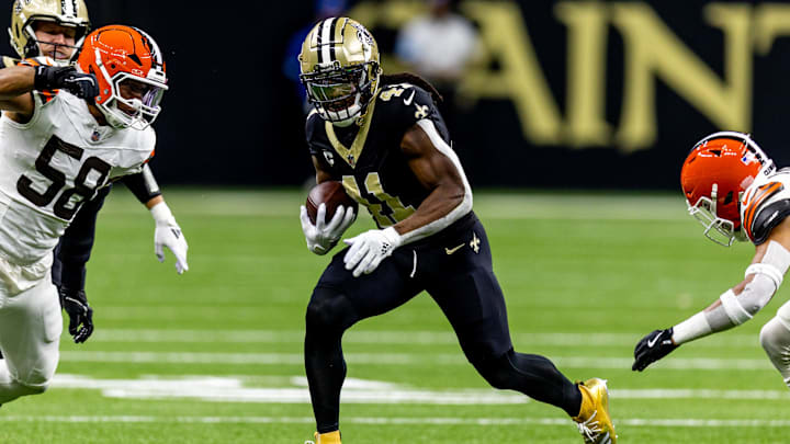 Nov 17, 2024; New Orleans, Louisiana, USA;  New Orleans Saints running back Alvin Kamara (41) rushes against Cleveland Browns linebacker Jordan Hicks (58) during the first half at Caesars Superdome. Mandatory Credit: Stephen Lew-Imagn Images