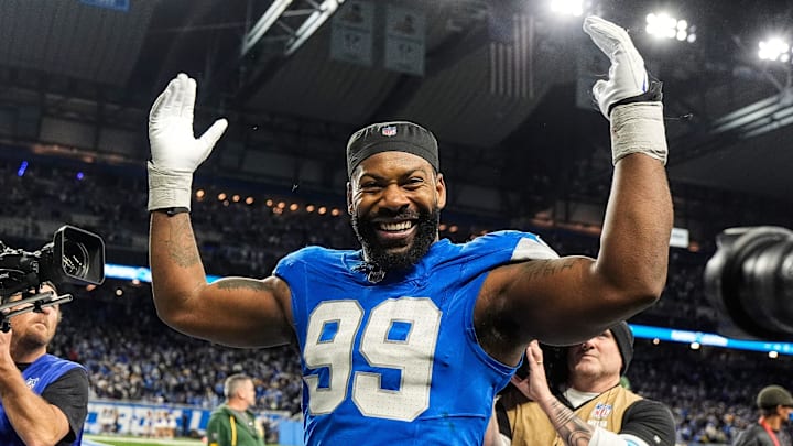 Detroit Lions defensive end Za'Darius Smith (99) celebrates 34-31 win over Green Bay Packers as he exits the field at Ford Field in Detroit on Thursday, Dec. 5, 2024.