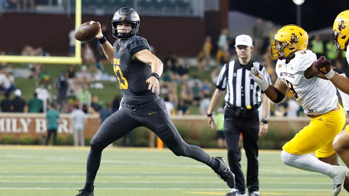 Sep 20, 2025; Waco, Texas, USA; Baylor Bears quarterback Sawyer Robertson (13) looks to pass as Arizona State Sun Devils defensive lineman Elijah O'Neal (9) defends during the first half at McLane Stadium. Mandatory Credit: Chris Jones-Imagn Images