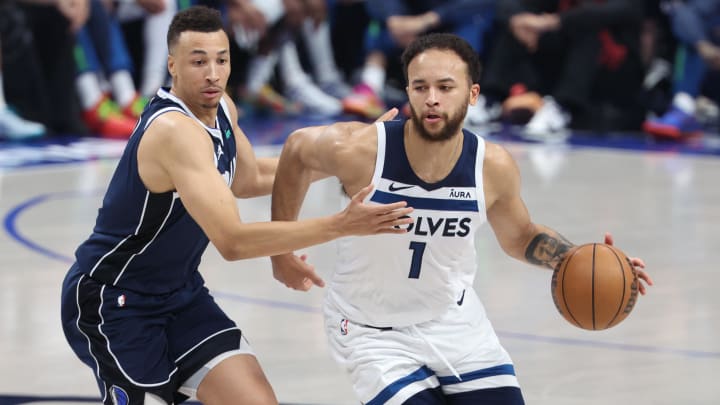 May 28, 2024; Dallas, Texas, USA; Minnesota Timberwolves forward Kyle Anderson (1) dribbles against Dallas Mavericks guard Dante Exum (0) during the second quarter of game four of the western conference finals for the 2024 NBA playoffs at American Airlines Center.