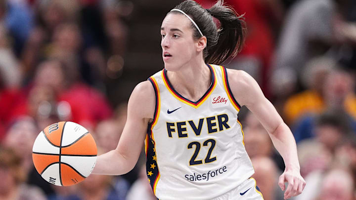 Indiana Fever guard Caitlin Clark (22) rushes up the court.