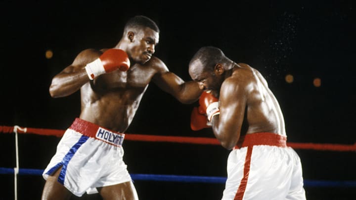 Jul 12, 1986; Atlanta, GA, USA; FILE PHOTO; Evander Holyfield battles Dwight Muhammad Qawi during their 1986 cruiserweight title match at the Omni. Holyfield defeated Qawi by split decision. Mandatory Credit: Manny Rubio-Imagn Images
