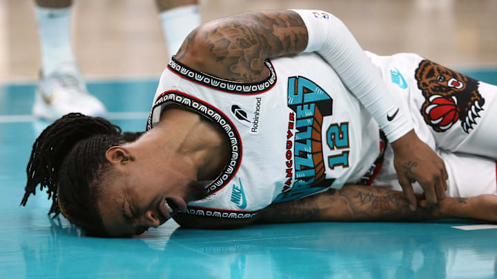 Apr 24, 2025; Memphis, Tennessee, USA; Memphis Grizzlies guard Ja Morant (12) lays on the court after being fouled during the second quarter against the Oklahoma City Thunder during game three for the first round of the 2024 NBA Playoffs at FedExForum. Mandatory Credit: Petre Thomas-Imagn Images