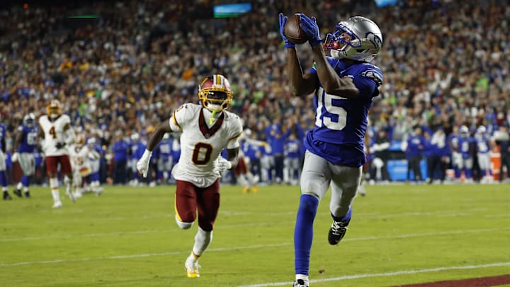Nov 2, 2025; Landover, Maryland, USA;  Seattle Seahawks wide receiver Tory Horton (15) catches a touchdown pass as Washington Commanders cornerback Mike Sainristil (0) watches during the second quarter at Northwest Stadium. Mandatory Credit: Geoff Burke-Imagn Images