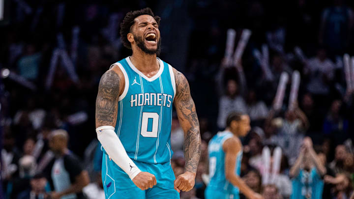 Mar 8, 2025; Charlotte, North Carolina, USA; Charlotte Hornets forward Miles Bridges (0) celebrates after taking the lead against the Brooklyn Nets during the fourth quarter at Spectrum Center. Mandatory Credit: Scott Kinser-Imagn Images
