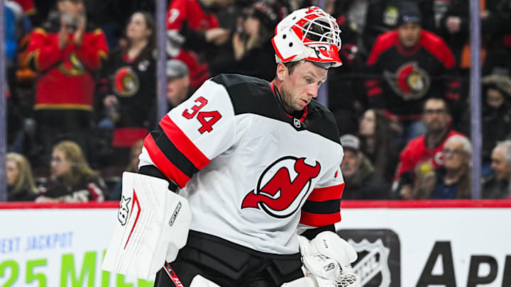Jan 31, 2026; Ottawa, Ontario, CAN; New Jersey Devils goalie Jake Allen (34) skates back to his net with his helmet up against the Ottawa Senators during the first period at Canadian Tire Centre. Mandatory Credit: David Kirouac-Imagn Images