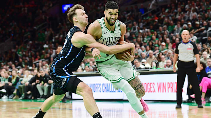 Apr 20, 2025; Boston, Massachusetts, USA; Orlando Magic forward Franz Wagner (22) tries to steal the ball from Boston Celtics forward Jayson Tatum (0) during the second half at TD Garden. Mandatory Credit: Bob DeChiara-Imagn Images