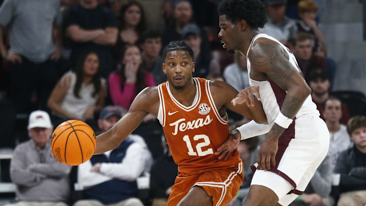 Mar 4, 2025; Starkville, Mississippi, USA; Texas Longhorns guard Tramon Mark (12) dribbles as Mississippi State Bulldogs forward Cameron Matthews (4) defends during the second half at Humphrey Coliseum. Mandatory Credit: Petre Thomas-Imagn Images Mar 4, 2025; Starkville, Mississippi, USA; Texas Longhorns guard Tramon Mark (12) dribbles as Mississippi State Bulldogs forward Cameron Matthews (4) defends during the second half at Humphrey Coliseum. Mandatory Credit: Petre Thomas-Imagn Images