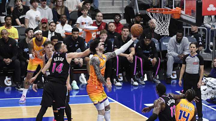 Mar 6, 2026; Charlotte, North Carolina, USA;  Charlotte Hornets guard LaMelo Ball (1) drives in past Miami Heat guard Tyler Herro (14) during the second half at the Spectrum Center. Mandatory Credit: Sam Sharpe-Imagn Images