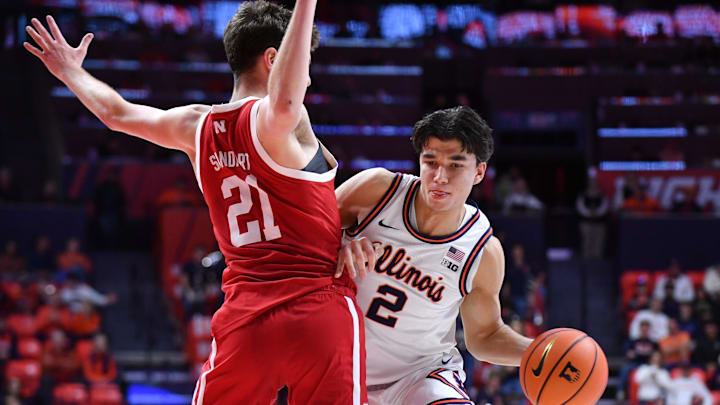 Dec 13, 2025; Champaign, Illinois, USA; Illinois Fighting Illini guard Andrej Stojakovic (2) drives the ball around Nebraska Cornhuskers forward Pryce Sandfort (21) during the first half at State Farm Center. Mandatory Credit: Ron Johnson-Imagn Images Dec 13, 2025; Champaign, Illinois, USA; Illinois Fighting Illini guard Andrej Stojakovic (2) drives the ball around Nebraska Cornhuskers forward Pryce Sandfort (21) during the first half at State Farm Center. Mandatory Credit: Ron Johnson-Imagn Images