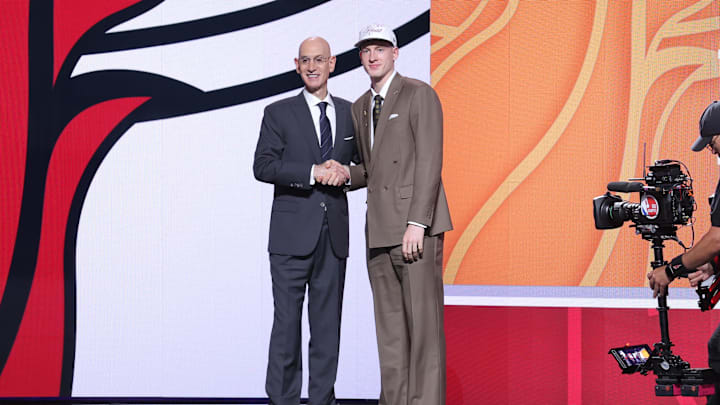 Jun 25, 2025; Brooklyn, NY, USA;  Kasparas Jakucionis stands with NBA commissioner Adam Silver after being selected as the 20th pick by the Miami Heat in the first round of the 2025 NBA Draft at Barclays Center. Mandatory Credit: Brad Penner-Imagn Images