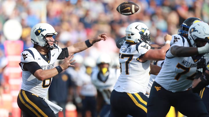 West Virginia Mountaineers quarterback Nicco Marchiol (8) throws a pass during the first half of the game against Kansas Jayhawks at David Booth Kansas Memorial Stadium on Sept. 20, 2025.
