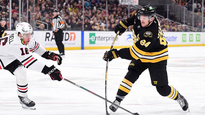 Oct 31, 2026; Boston, Massachusetts, USA; Boston Bruins left wing Tanner Jeannot (84) shoots the puck while Chicago Blackhawks center Anton Frondell (16) defends during the first period at TD Garden. Mandatory Credit: Bob DeChiara-Imagn Images Oct 31, 2026; Boston, Massachusetts, USA; Boston Bruins left wing Tanner Jeannot (84) shoots the puck while Chicago Blackhawks center Anton Frondell (16) defends during the first period at TD Garden. Mandatory Credit: Bob DeChiara-Imagn Images