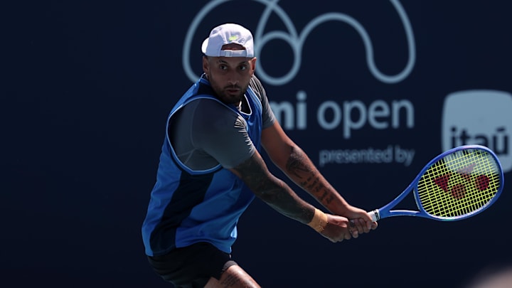 Nick Kyrgios hits a backhand