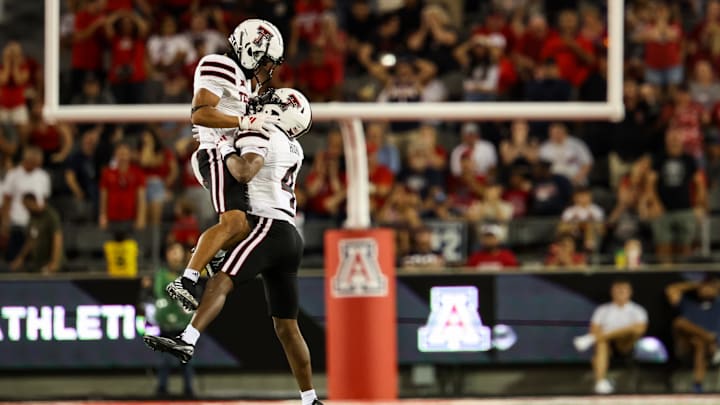 Oct 5, 2024; Tucson, Arizona, USA; Texas Tech Red Raiders center back Maurion Horn celebrates turnover with teammate during fourth quarter against Arizona Wildcats at Arizona Stadium. Mandatory Credit: Aryanna Frank-Imagn Images