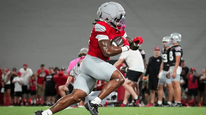Ohio State Buckeyes running back Isaiah West (32) runs during football training camp inside the Woody Hayes Athletic Center in Columbus on Aug. 7, 2026. Ohio State Buckeyes running back Isaiah West (32) runs during football training camp inside the Woody Hayes Athletic Center in Columbus on Aug. 7, 2026.
