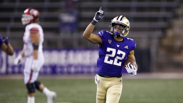 Nov 28, 2020; Seattle, Washington, USA; Washington Huskies defensive back Trent McDuffie (22) celebrates following an interception against the Utah Utes during the fourth quarter at Alaska Airlines Field at Husky Stadium. Mandatory Credit: Joe Nicholson-Imagn Images Nov 28, 2020; Seattle, Washington, USA; Washington Huskies defensive back Trent McDuffie (22) celebrates following an interception against the Utah Utes during the fourth quarter at Alaska Airlines Field at Husky Stadium. Mandatory Credit: Joe Nicholson-Imagn Images
