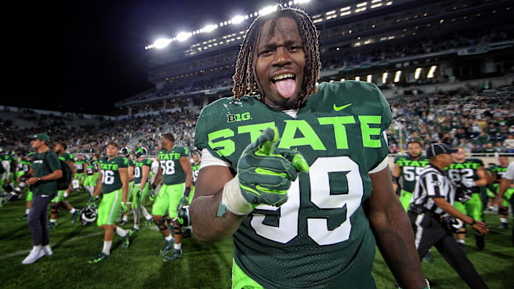Sep 7, 2019; East Lansing, MI, USA; Michigan State Spartans defensive tackle Raequan Williams (99) celebrates a win over Western Michigan Broncos after a game at Spartan Stadium. Mandatory Credit: Mike Carter-Imagn Images