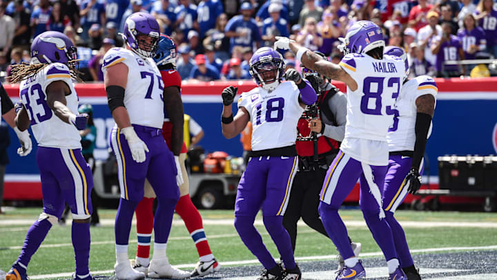 Sep 8, 2024; East Rutherford, New Jersey, USA; Minnesota Vikings wide receiver Justin Jefferson (18) celebrates after scoring a touchdown against the New York Giants during the first half at MetLife Stadium.