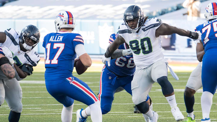 Nov 8, 2020; Orchard Park, New York, USA; Seattle Seahawks defensive tackle Jarran Reed (90) applies pressure to Buffalo Bills quarterback Josh Allen (17) in the third quarter at Bills Stadium. Mandatory Credit: Mark Konezny-Imagn Images Nov 8, 2020; Orchard Park, New York, USA; Seattle Seahawks defensive tackle Jarran Reed (90) applies pressure to Buffalo Bills quarterback Josh Allen (17) in the third quarter at Bills Stadium. Mandatory Credit: Mark Konezny-Imagn Images