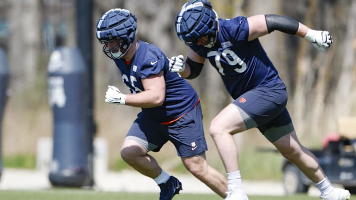 Theo Benedet (right), running at camp alongside Luke Newman, is one possible answer for the Bears at left tackle.