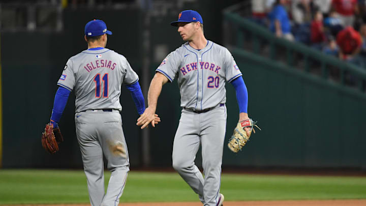 Oct 5, 2024; Philadelphia, PA, USA; New York Mets first baseman Pete Alonso (20) and New York Mets second baseman Jose Iglesias (11) celebrate after defeating the Philadelphia Phillies in game one of the NLDS for the 2024 MLB Playoffs at Citizens Bank Park. Mandatory Credit: Eric Hartline-Imagn Images