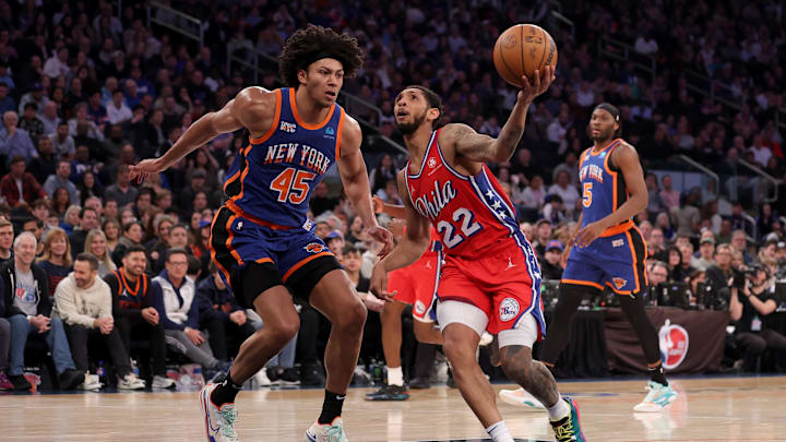 Mar 10, 2024; New York, New York, USA; Philadelphia 76ers guard Cameron Payne (22) drives to the basket against New York Knicks center Jericho Sims (45) and forward Precious Achiuwa (5) during the second quarter at Madison Square Garden. Mandatory Credit: Brad Penner-USA TODAY Sports