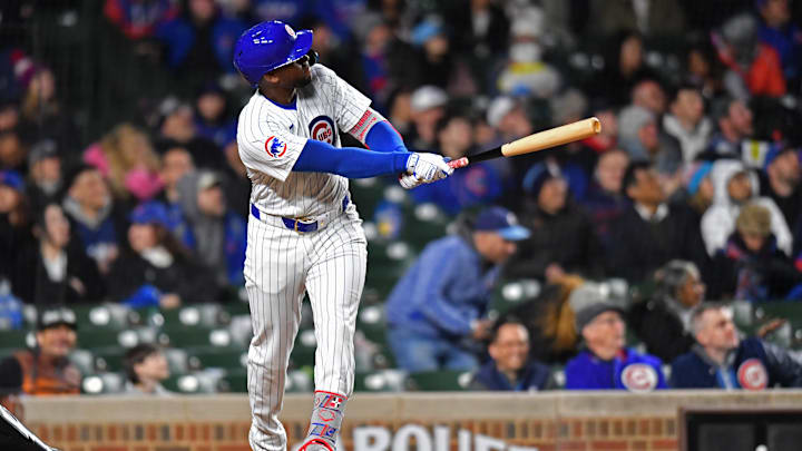 Apr 20, 2024; Chicago, Illinois, USA; Chicago Cubs outfielder Alexander Canario (4) hits a home run during the sixth inning against the Miami Marlins at Wrigley Field.
