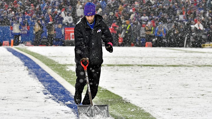 Jan 22, 2023; Orchard Park, New York, USA; Field crews work on clearing snow from the field during
