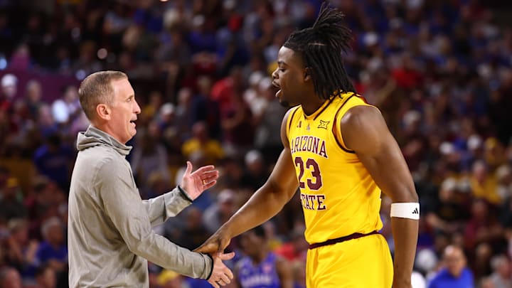 Mar 3, 2026; Tempe, Arizona, USA; Arizona State Sun Devils forward Allen Mukeba (23) with head coach Bobby Hurley against the Kansas Jayhawks in the first half at Desert Financial Arena. Mandatory Credit: Mark J. Rebilas-Imagn Images
