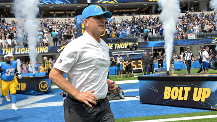 Sep 8, 2024; Inglewood, California, USA; Los Angeles Chargers head coach Jim Harbaugh leads the team on to the field for the game against the Las Vegas Raiders at SoFi Stadium.