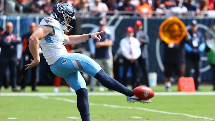 Sep 8, 2024; Chicago, Illinois, USA; Tennessee Titans punter Ryan Stonehouse (4) punts the ball against the Chicago Bears during the first quarter at Soldier Field. Sep 8, 2024; Chicago, Illinois, USA; Tennessee Titans punter Ryan Stonehouse (4) punts the ball against the Chicago Bears during the first quarter at Soldier Field.