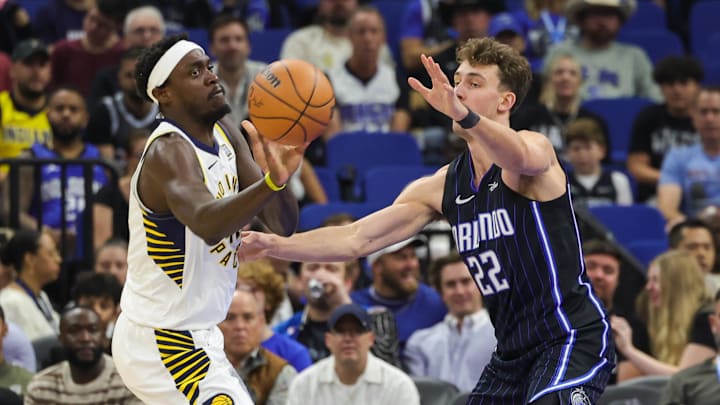 Indiana Pacers forward Pascal Siakam (43) passes the ball around Orlando Magic forward Franz Wagner (22) during the first quarter at Kia Center. 